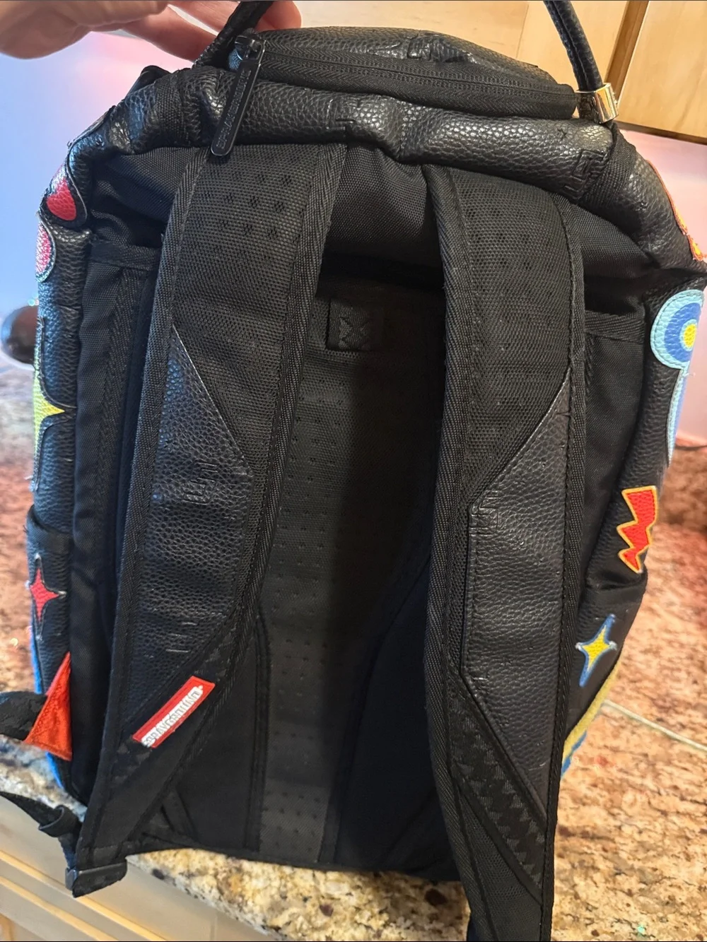 Sprayground Black Backpack with Neon Green Bear Patch and Multicolor Accents